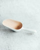 These delicate porcelain scoops are modelled after the the classic stainless steel variety we so often see in bakeries and candy shops.Measures 1/4 cup. Glazed interior, smooth stony exterior.Ces délicates cuillères à bonbons sont modelées sur la sorte de cuillères en acier inoxydable classiques qu’on voit souvent dans les boulangeries et les confiseries.Peut contenir ¼ tasse. Extérieur avec fini lisse et pierreux et intérieur émaillé.