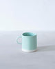 Delicate and lightweight, yet durable enough for your daily coffee and tea, these mugs are decorated with our signature colours.Material: porcelain / Délicates et légères, mais assez durables pour votre café ou thé quotidien, ces tasses sont décorées avec nos couleurs signature.Matériau : porcelaine